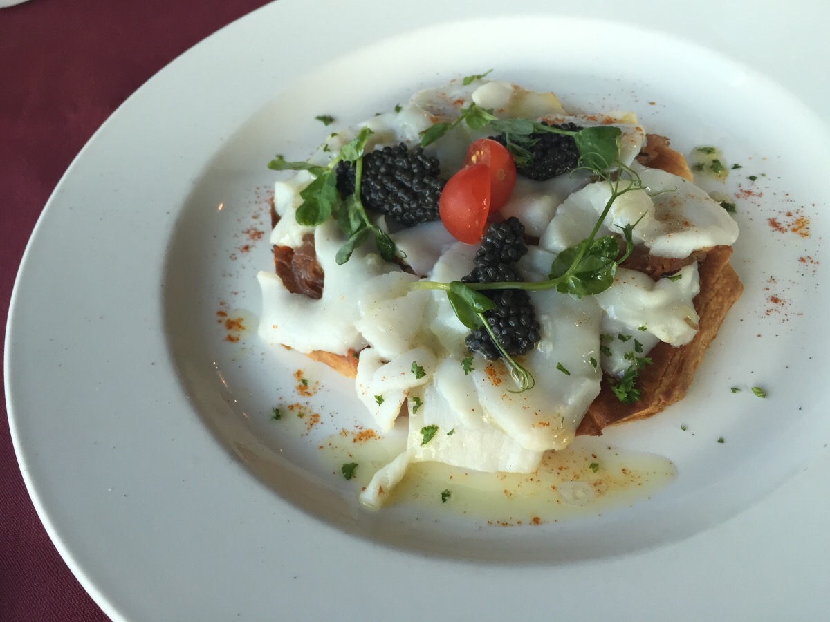 tart st. jacques of scallops, caviar, dressing violet and pansy