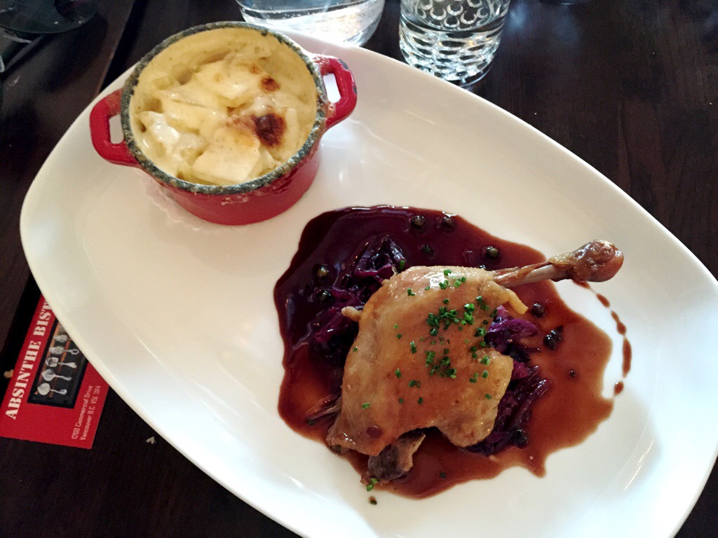 duck leg confit, braised red cabbage, and potato gratin