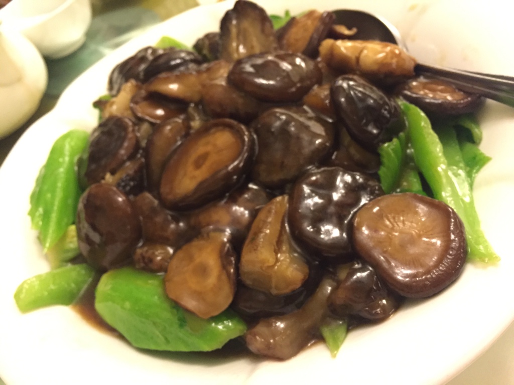 sea cucumber and shiitake with mustard greens