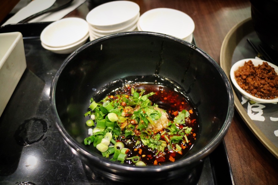 Preparing the crossing the bridge noodle bowl
