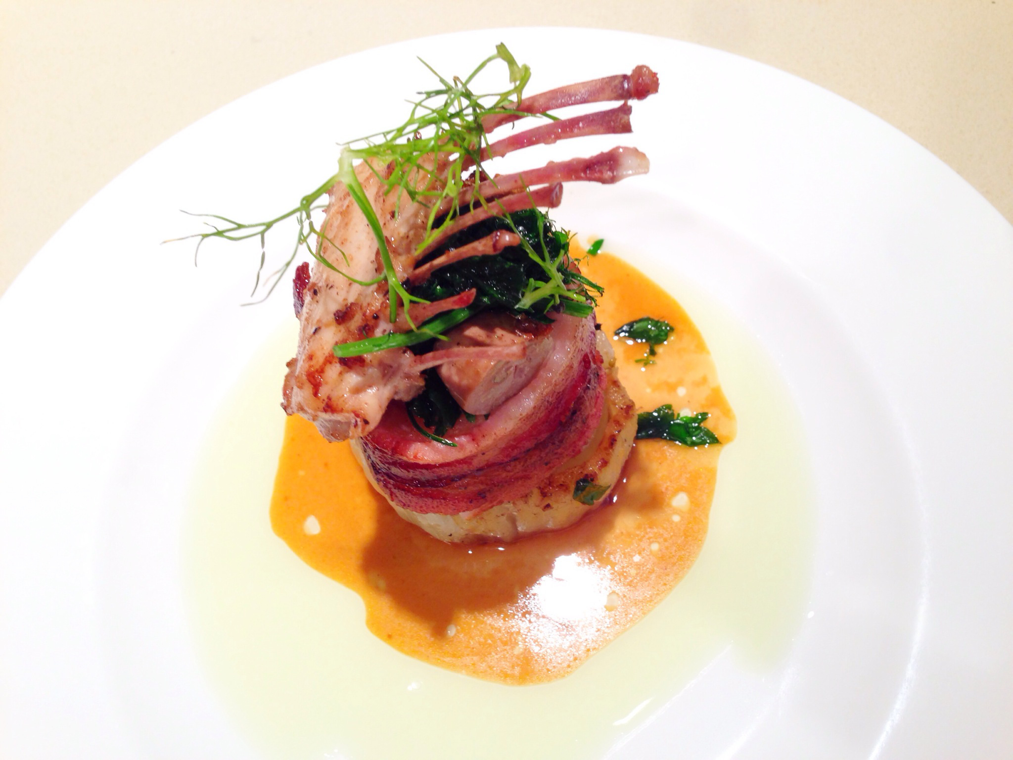 Saddle of Rabbit in Applewood-Smoked Bacon with Caramelized Fennel and Fennel Oil